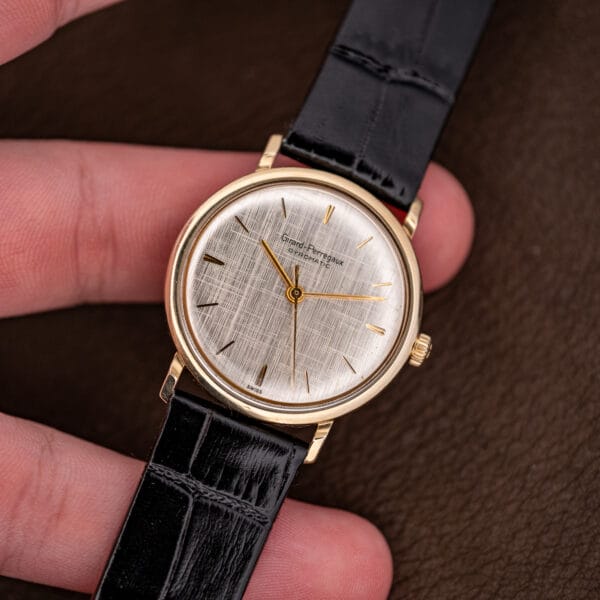 Girard Perregaux Gyromatic held in hand for scale, 31.5mm gold filled case and silver linen dial