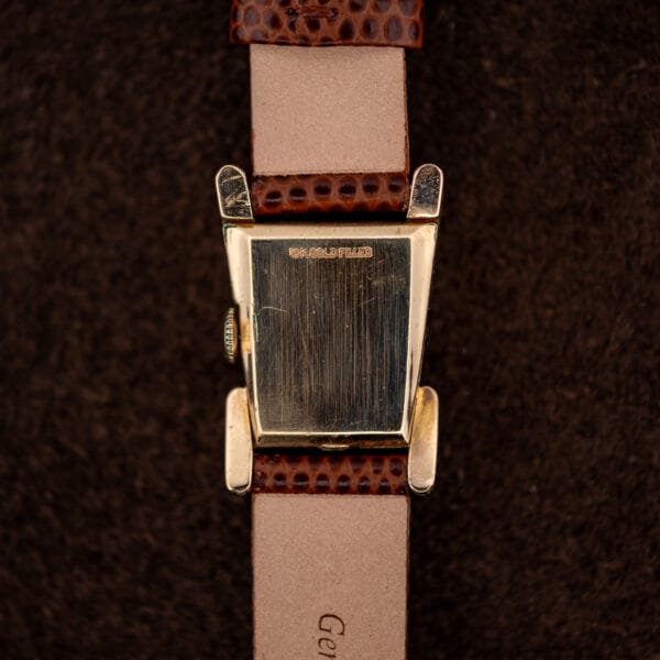 Outer caseback of the LeCoultre Aristocrat stamped 10K. GOLD FILLED, showing warm patina and light honest wear.