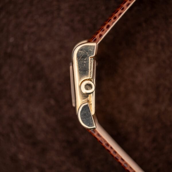 Side profile of the LeCoultre Aristocrat case flank, polished 10k gold filled with honest surface scratches.