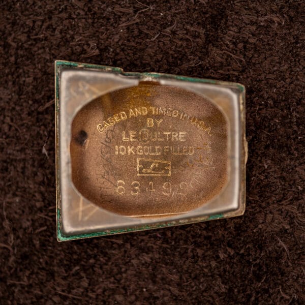 Inner caseback engraved CASED AND TIMED IN U.S.A. BY LeCoultre 10K GOLD FILLED with the case serial number.