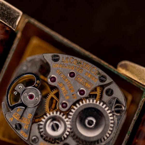Macro of the LeCoultre Co. movement bridge stamped 490/BW, seventeen jewels and unadjusted Swiss markings.