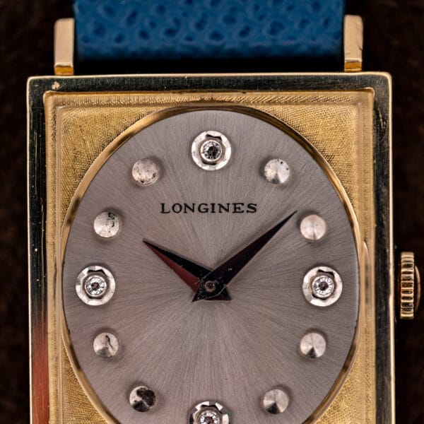 Longines 3217-428 dial macro showing the diamond marker at twelve and Florentine cross-hatched gold filled surround