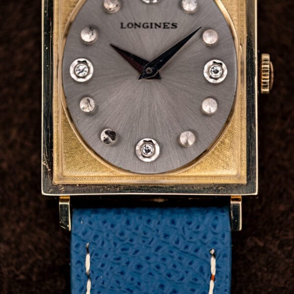 Silver starburst dial of the Longines Tank 3217-428 with diamonds set at three, six and nine o'clock