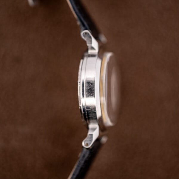 Side profile of the Movado Acvatic showing the domed crystal and sculpted scarab lug.