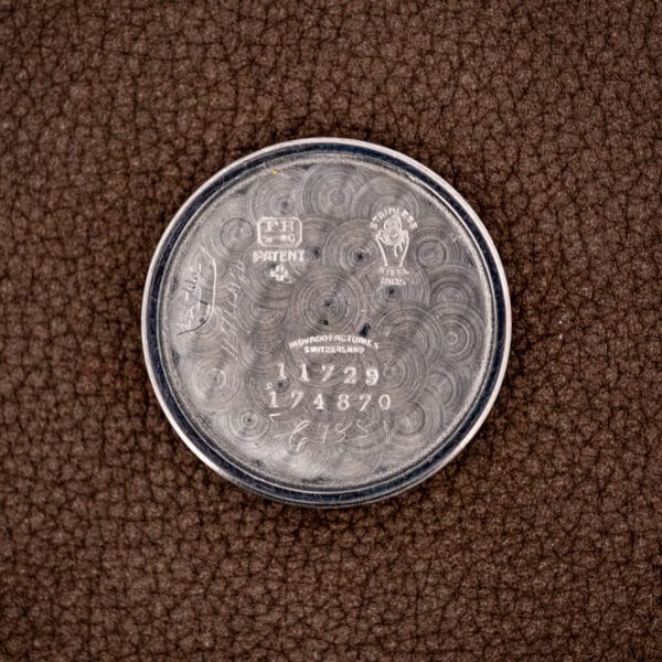 Movado inner caseback stamped Movado Factories Switzerland, reference 11729 and case number 174870.