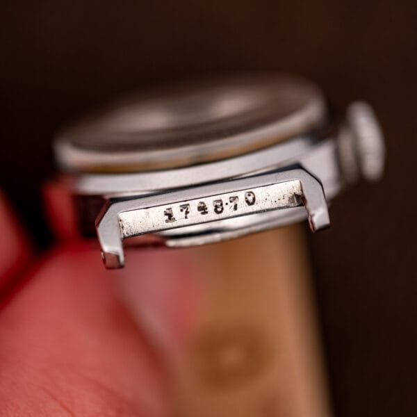 Movado case serial 174870 stamped between the lugs, stainless steel case detail.