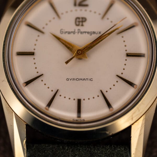 Girard-Perregaux Gyromatic dial close-up with GYROMATIC printing and SWISS at six o'clock