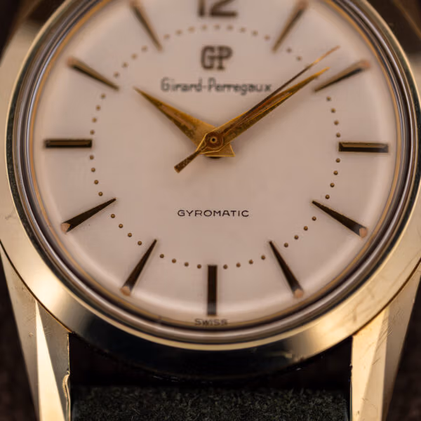 Girard-Perregaux Gyromatic dial close-up with GYROMATIC printing and SWISS at six o'clock