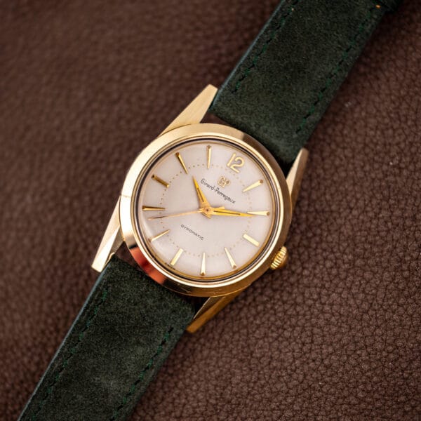 Vintage Girard-Perregaux Gyromatic dress watch with round gold capped case and white dial