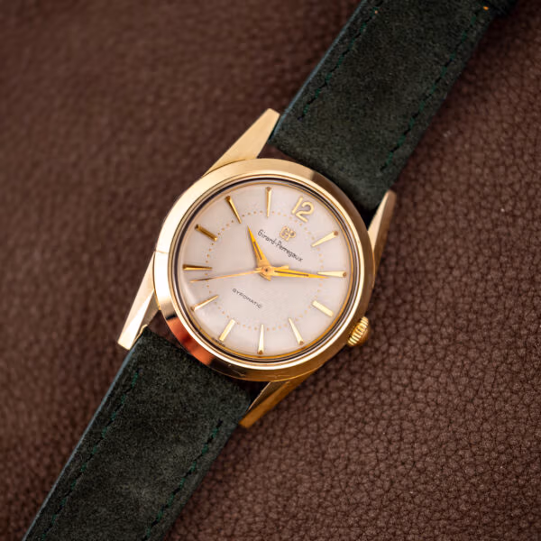 Vintage Girard-Perregaux Gyromatic dress watch with round gold capped case and white dial