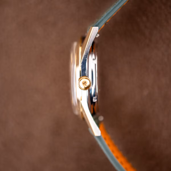 Girard-Perregaux Gyromatic profile with GP signed gold crown where the gold cap meets the steel case band