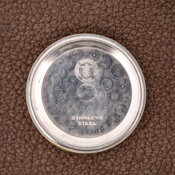 Girard-Perregaux inner caseback stamped STAINLESS STEEL with the eagle and anchor maker's cartouche