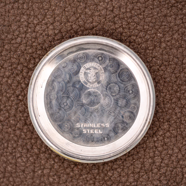Girard-Perregaux inner caseback stamped STAINLESS STEEL with the eagle and anchor maker's cartouche