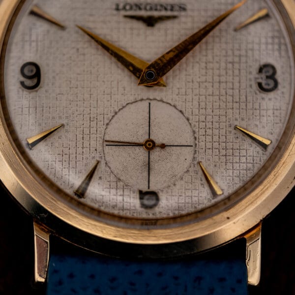 Longines 1044 sub-seconds register at six with crosshair and concentric center set into the waffle grid