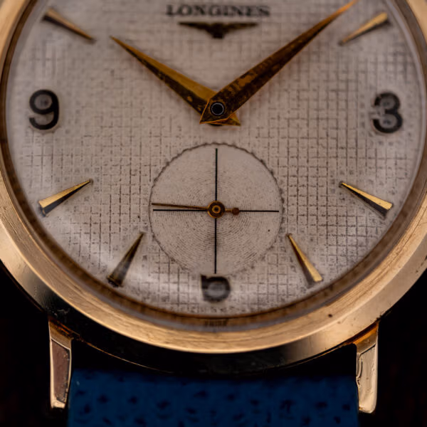 Longines 1044 sub-seconds register at six with crosshair and concentric center set into the waffle grid