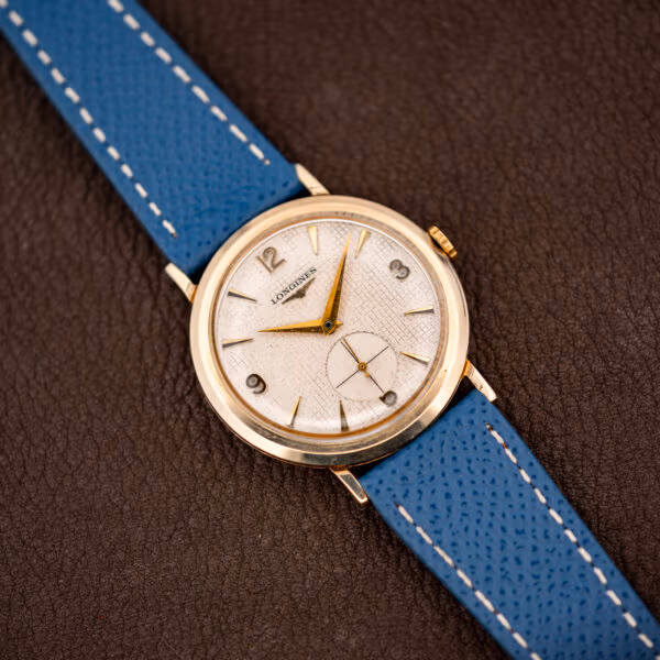 Longines waffle dial 1044 three-quarter view showing 32.5mm gold filled case and fluted crown