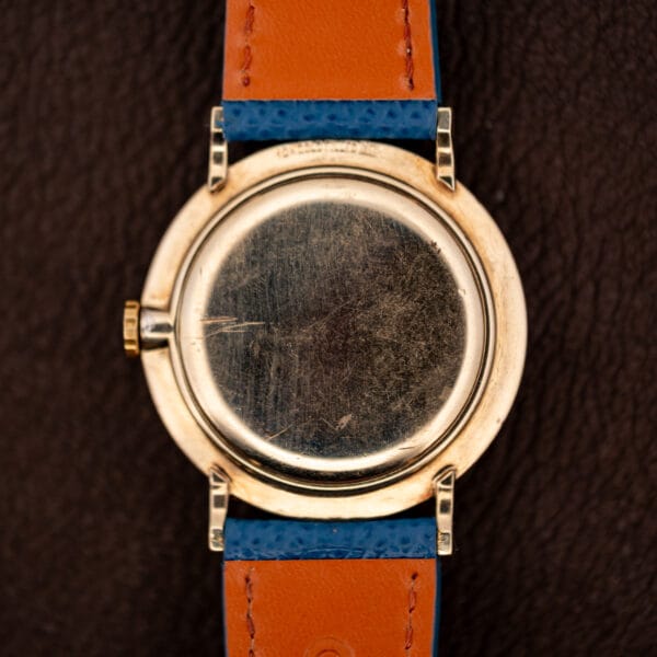 Longines Ref. 1044 caseback exterior in 10k gold filled carrying decades of honest hairline wear
