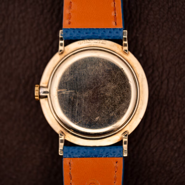 Longines Ref. 1044 caseback exterior in 10k gold filled carrying decades of honest hairline wear