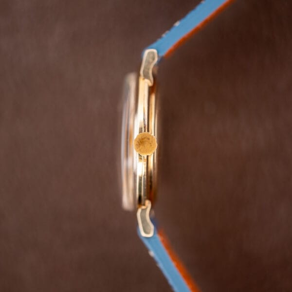 Longines waffle dial 1044 side profile with fluted gold crown and domed acrylic crystal
