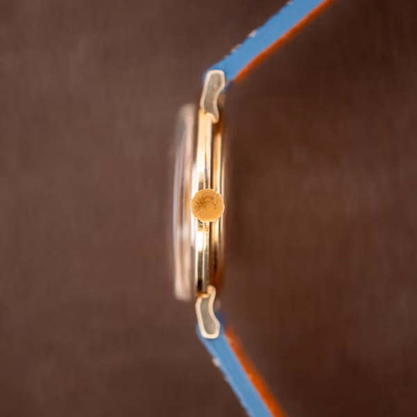 Longines waffle dial 1044 side profile with fluted gold crown and domed acrylic crystal