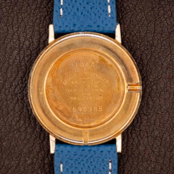 Longines 1044 inner caseback stamped LONGINES-WITTNAUER over NEW YORK, GENEVA and MONTREAL with reference 1044