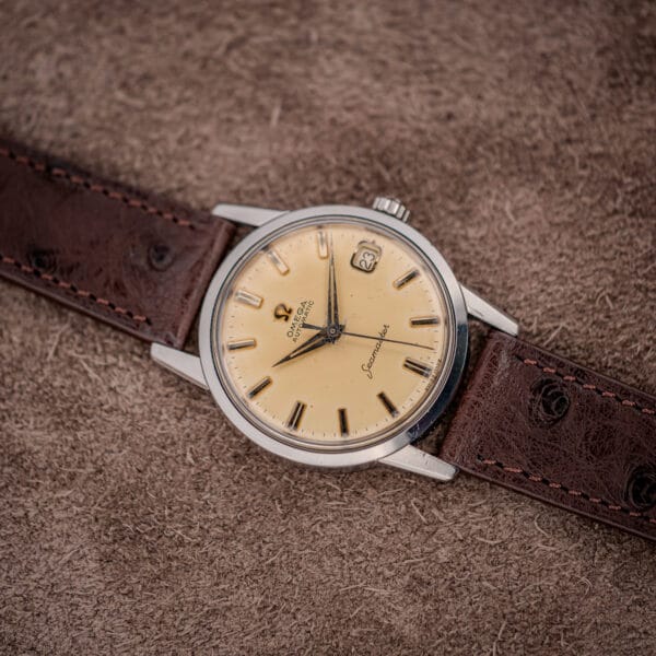 Omega Seamaster reference 14760 on brown ostrich strap, 34mm steel case with smooth bezel and tapered lugs