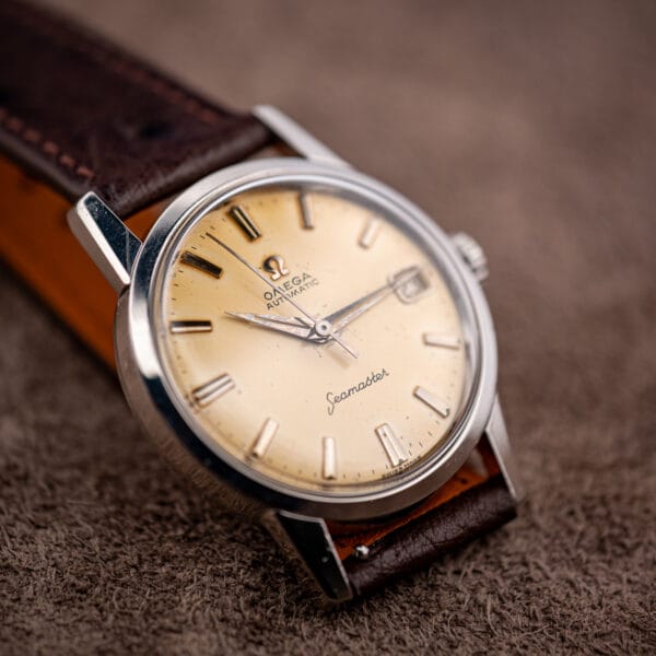 Vintage Omega Seamaster 14760 upright on chocolate ostrich strap, cream dial with date aperture at three