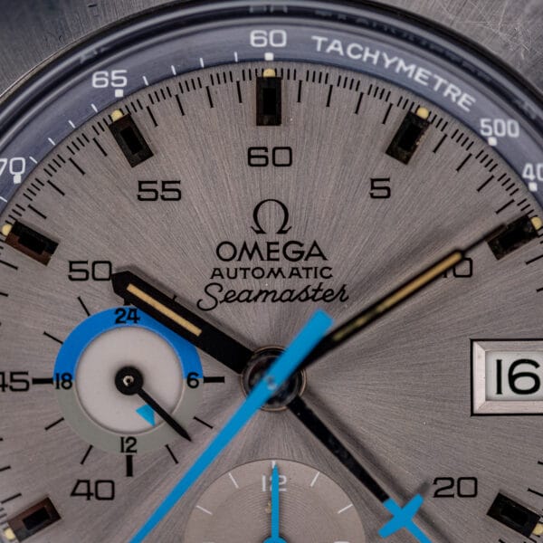 Omega Seamaster 176.007 dial macro showing Omega Automatic Seamaster signature and the blue day and night register