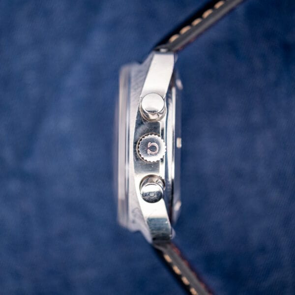 Omega 176.007 case profile with signed Omega crown flanked by two pump chronograph pushers and domed crystal