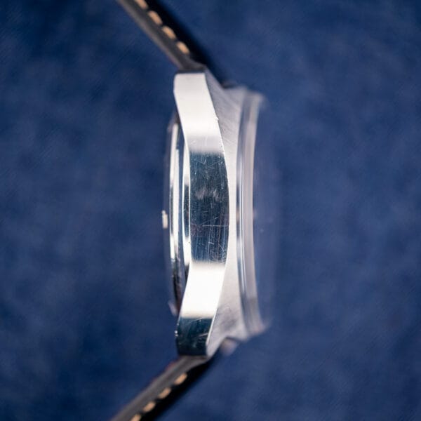 Omega Seamaster 176.007 polished case flank in profile showing honest wear and the domed acrylic crystal edge