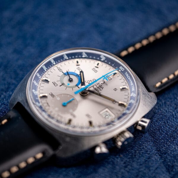 Omega Seamaster 176.007 Blue Jedi tilted to catch light across the silver sunburst dial and blue jet hand