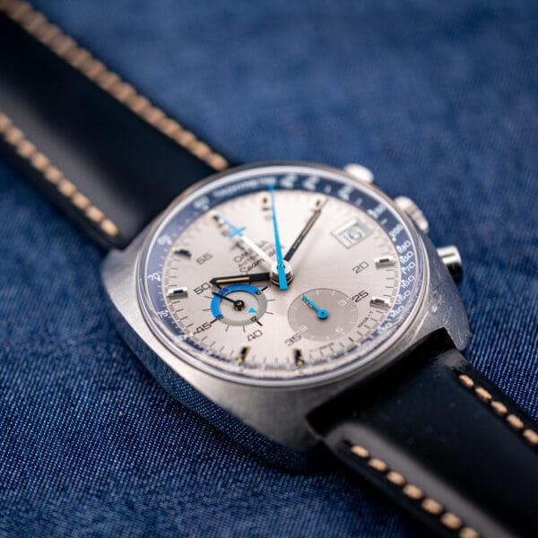 Vintage Omega 176.007 chronograph three quarter view showing cushion case lugs and cross tipped central minute hand