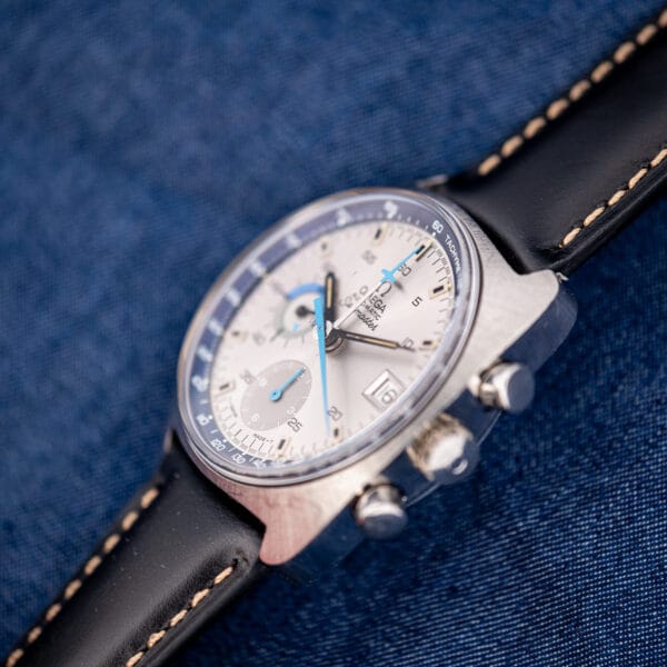 Omega 176.007 Blue Jedi at a low angle showing case thickness pushers and the blue grey tachymetre scale