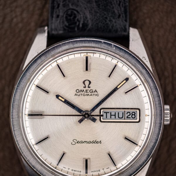 Omega Seamaster 166.032 dial macro showing applied baton markers and T SWISS MADE T tritium text