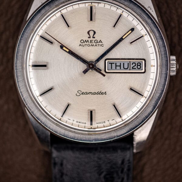 Omega 166.032 silver brushed dial, Seamaster script at six, framed day-date aperture beside applied batons