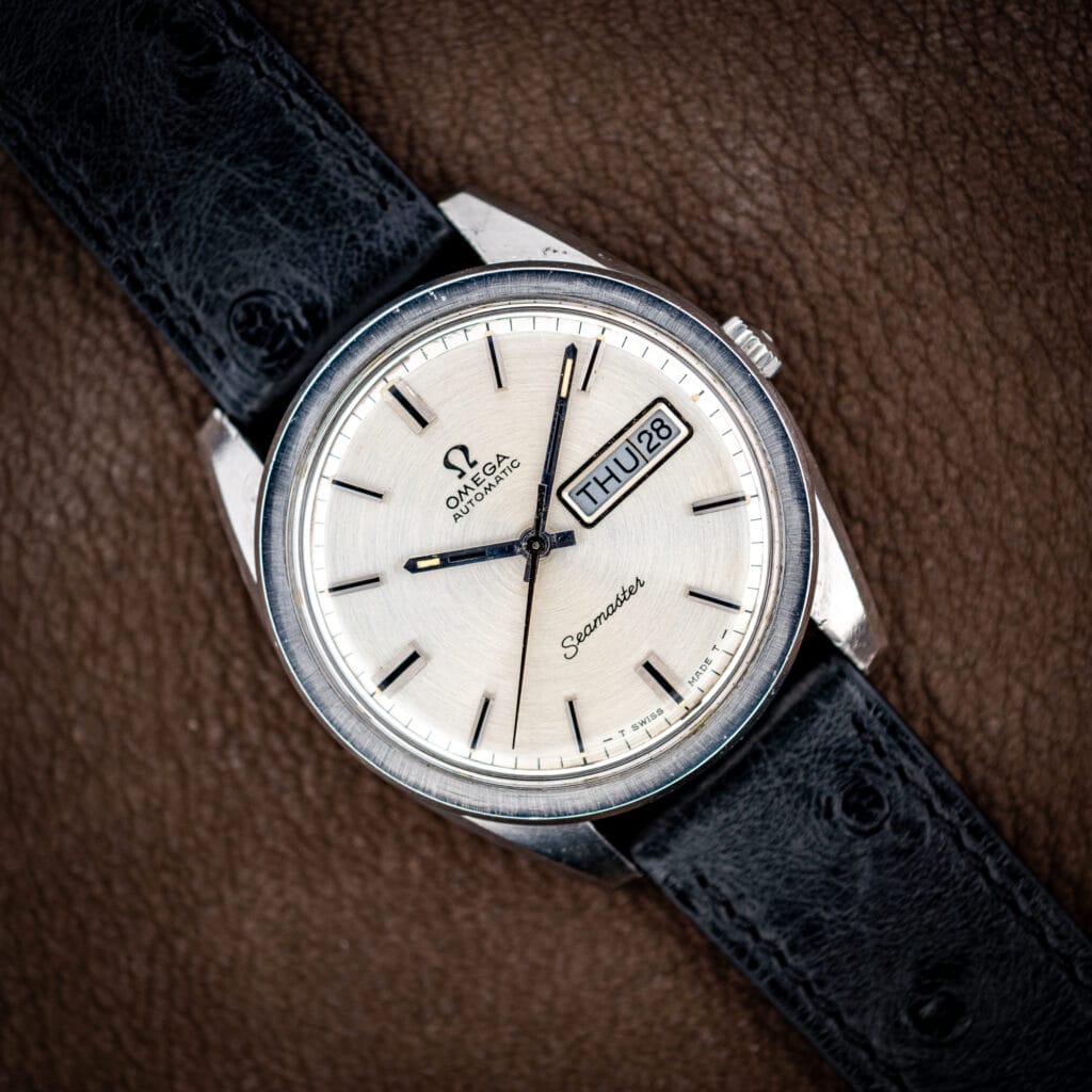 Omega Seamaster 166.032 silver dial with day and date at three, on a black ostrich strap