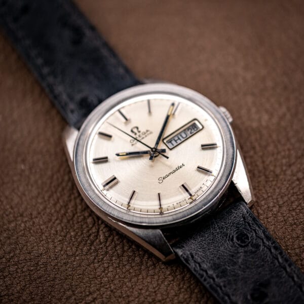 Omega Seamaster 166.032 stainless steel case and silver dial seen from above on ostrich leather