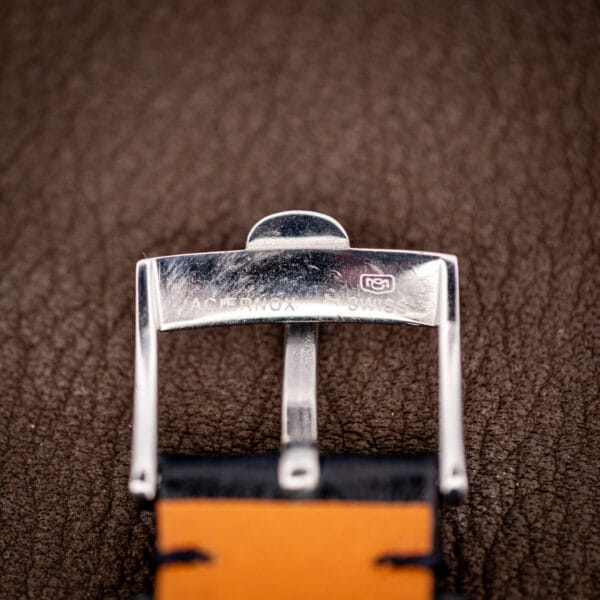 Underside of the buckle on the Omega Seamaster 166.032 strap, stamped ACIER INOX and SWISS