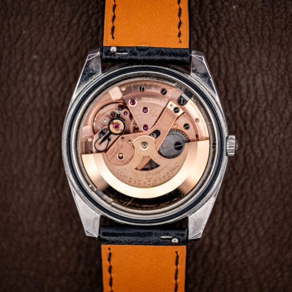 Omega calibre 750 automatic movement in the 166.032 case, copper-plated and signed OMEGA WATCH Co SWISS