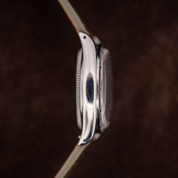 Rolex Oyster Perpetual 6085 side profile showing the domed semi bubbleback caseback and polished lugs