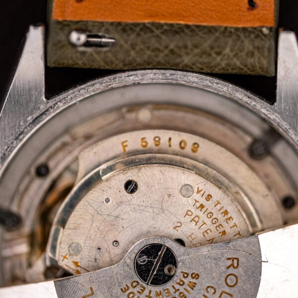 Macro of the Rolex 6085 Perpetual movement bridge with gold VIS TIRETTE and TRIGGER SCREW lettering