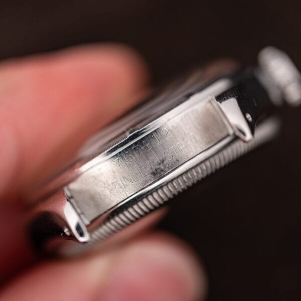 Case serial 767112 stamped over STAINLESS STEEL between the lower lugs of the Rolex 6085