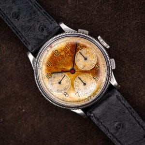 Benrus Sky Chief chronograph with tropical amber dial, coin-edged bezel and black ostrich leather strap