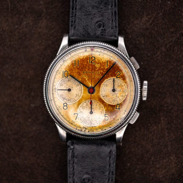 Benrus Sky Chief chronograph head-on, three silvered registers on a deeply patinated dial