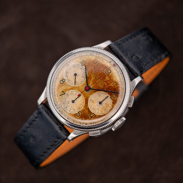 Benrus Sky Chief chronograph on black ostrich strap with tan leather lining, three-quarter view