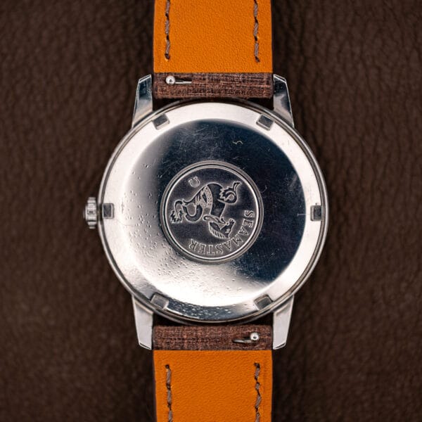 Omega Seamaster 165.002 steel caseback with the raised hippocampus medallion encircled by SEAMASTER