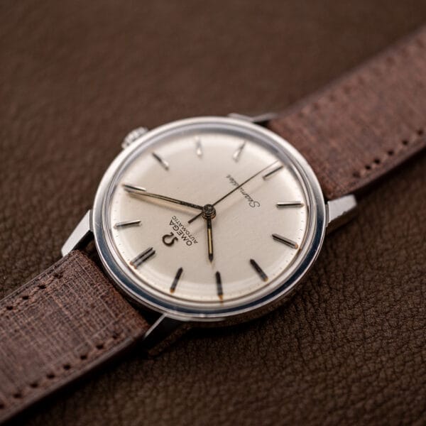 Omega 165.002 Seamaster automatic, faceted alpha hands and aged tritium fill on the brushed silver dial