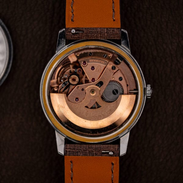 Omega caliber 552 automatic movement in the case, rose gilt bridges and full rotor, caseback removed