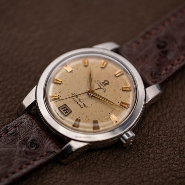 Omega Seamaster Calendar 2757-2 SC three-quarter view, gold markers catching light across the aged dial