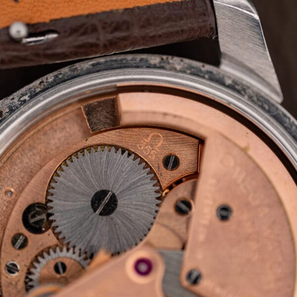 Omega caliber 355 marking stamped on the rose gilt bridge beside the ratchet wheel